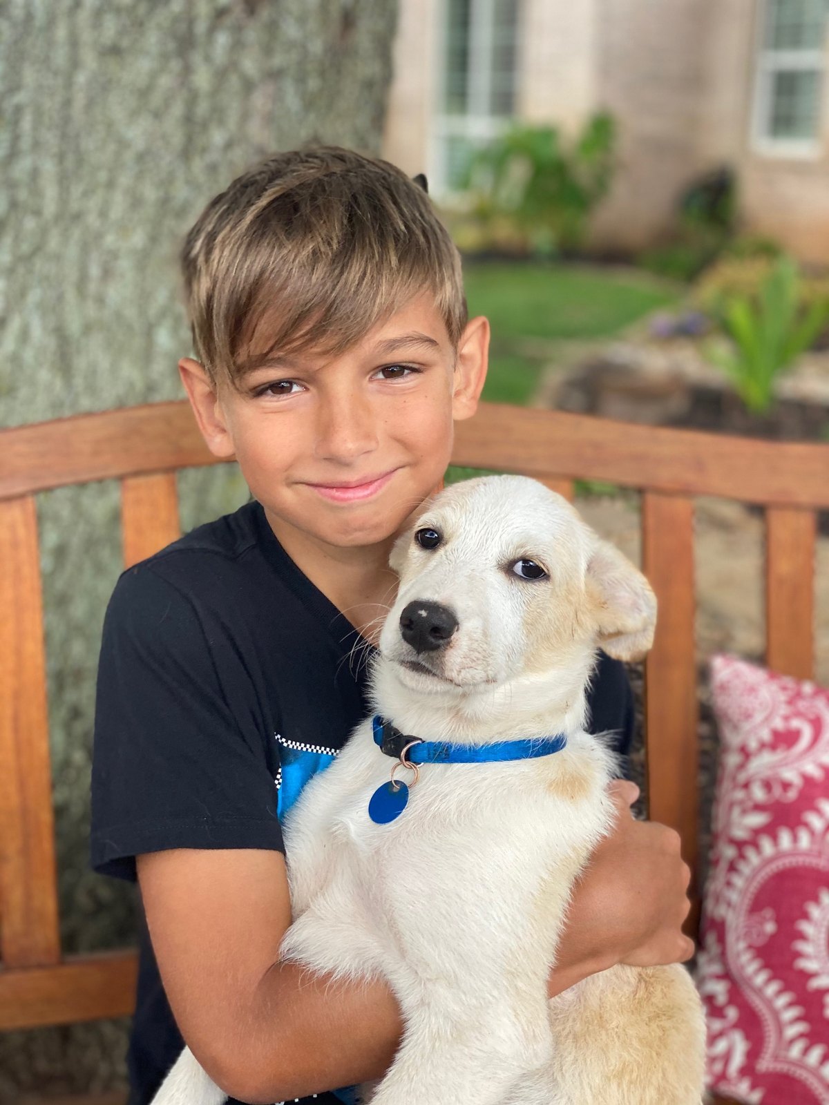 Carson holding puppy Bagel in September 2020