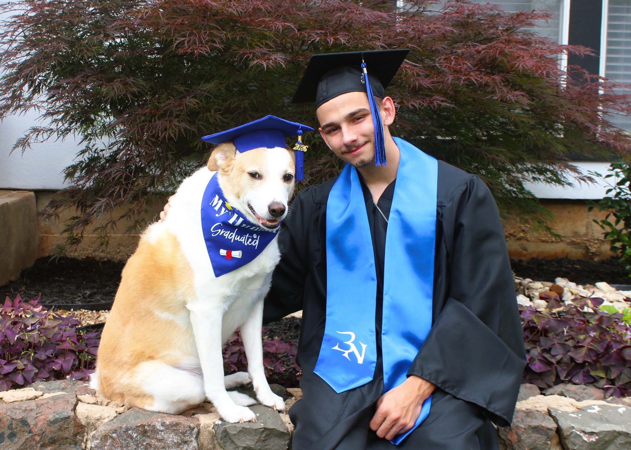 Carson and Bagel celebrating graduation